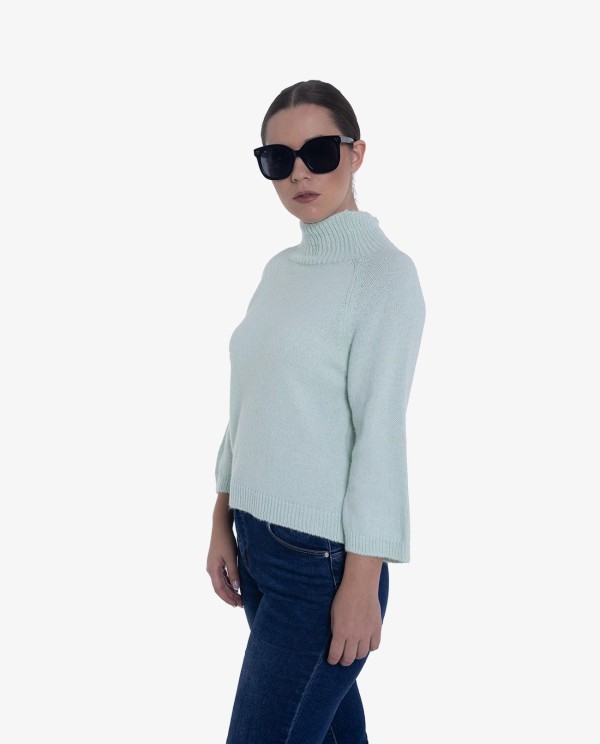 Cuplé JERSEY DE PUNTO VERDE CON CUELLO ALTO Y MANGAS TRES CUARTOS Libre de impuestos